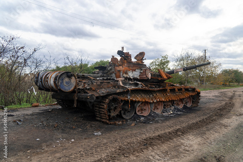 War in Ukraine. 2022 Russian invasion of Ukraine. Countryside. After the battle. Destroyed burnt battle tank stands on the road