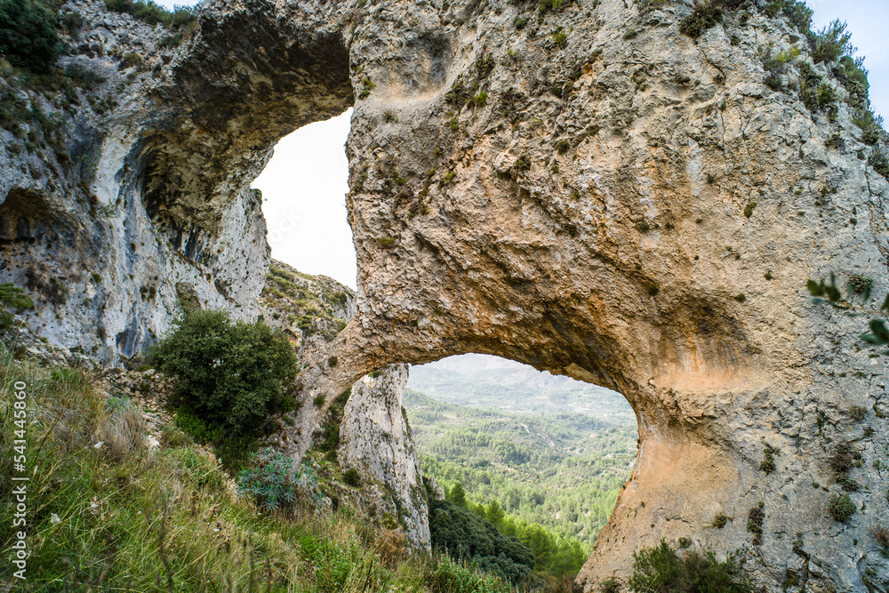 Los Arcs hiking path. a tourist route surrounded by greenery, mountains, valleys, natural rock bridges. Ruta and los Arcos de Castillos