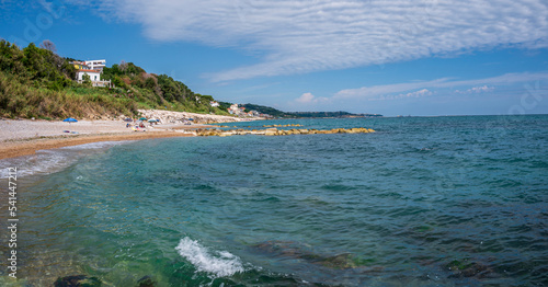 The beautiful beach of Calata Turchina with crystal clear and blue sea photo