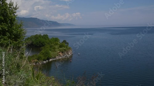 People ride saps on Lake Baikal