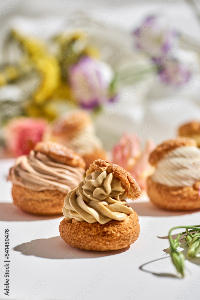 tasty cake shu or eclairs with cream on white background with copy space tasty cake shu or eclairs with cream on white background with copy space