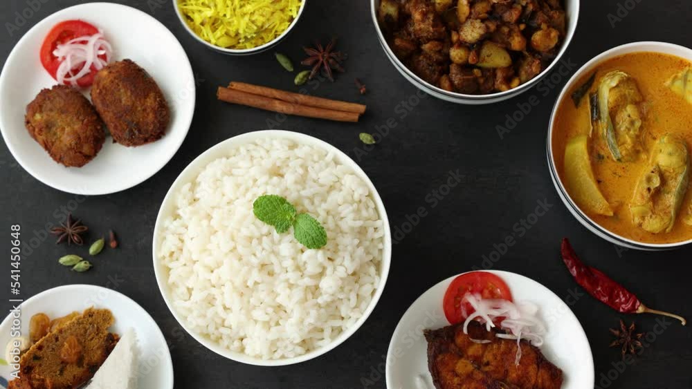 Top view of white rice spicy hot Bengali Prawn roast , shrimp masala fish curry. Indian food. Fish fry beef pork cutlet. Asian cuisine. Kerala, Goan fish curry clay pot. Grilled tiger shrimps Top view of white rice spicy hot Bengali Prawn roast , shrimp masala fish curry. Indian food. Fish fry beef pork cutlet. Asian cuisine. Kerala, Goan fish curry clay pot. Grilled tiger shrimps