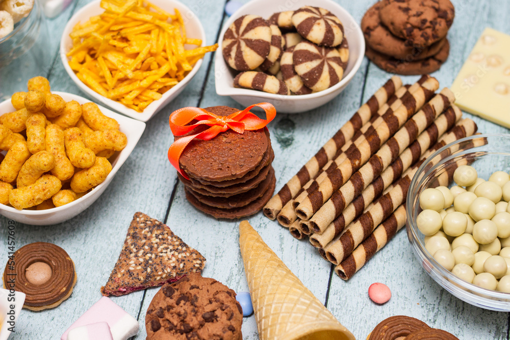 Salty and sweet snacks. Table of salty and sweet snacks. Large group of unhealthy food Salty and sweet snacks. Table of salty and sweet snacks. Large group of unhealthy food