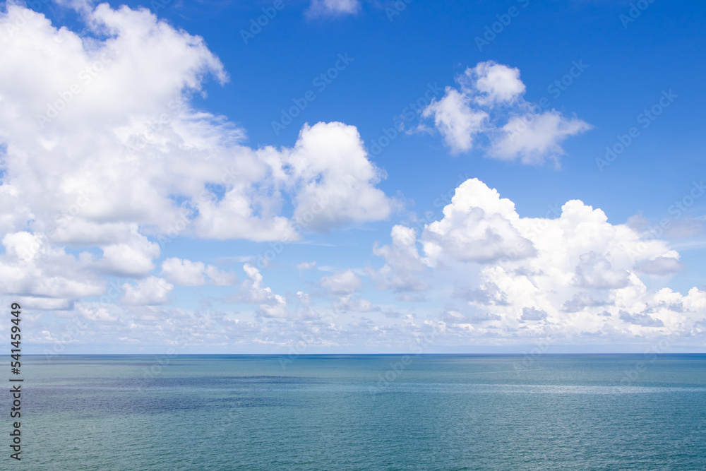 Beautiful calm turquoise color sea and blue sky with white color cloud background Beautiful calm turquoise color sea and blue sky with white color cloud background