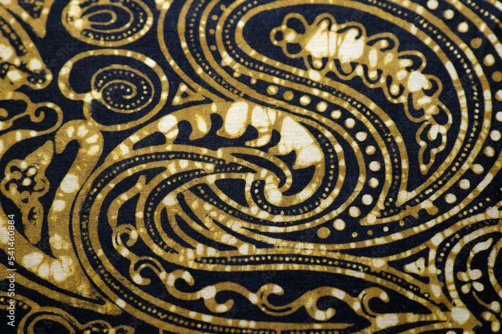 black and mustard color antique batik fabric texture.