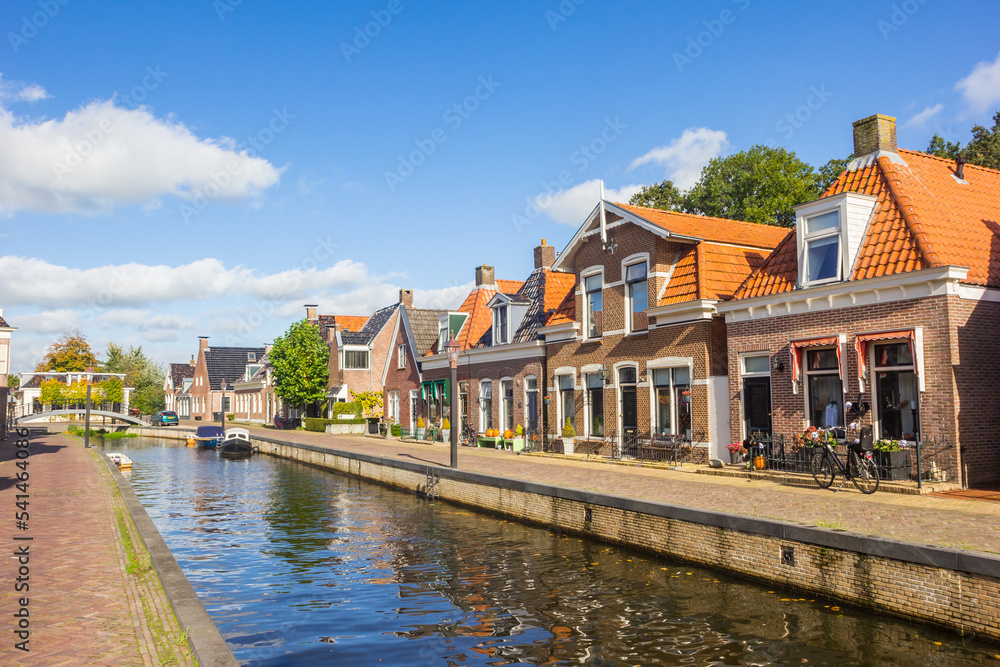 Old houses at the central canal of Kollum, Netherlands