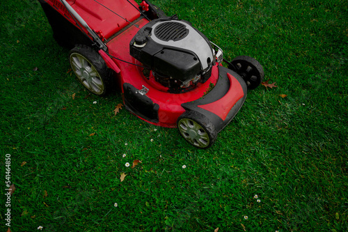 Lawn mowers cut grass. Concept garden work background