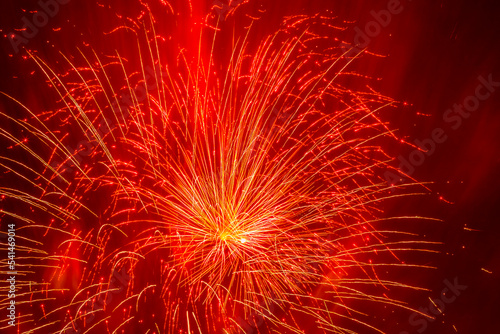 oliday background  yellow fireworks against red smoke