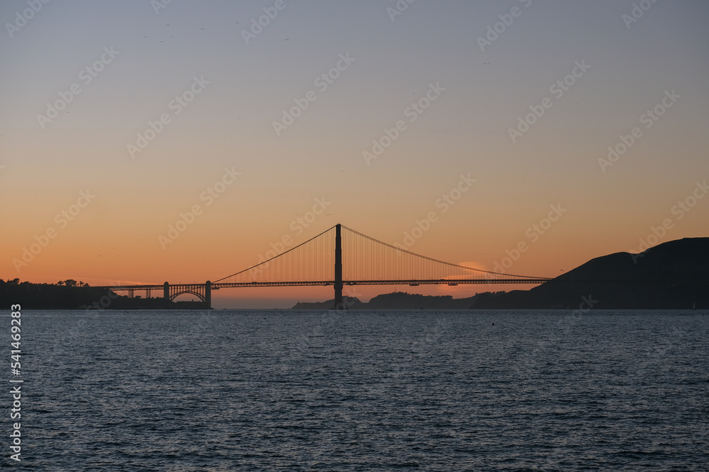 Fototapeta premium Panoramic scenic aerial view over San Francisco Bay Area with Golden Gate Bridge, downtown skyline cityscape and Alcatraz island sailing boats yachts harbor landmark sights Tower scenery