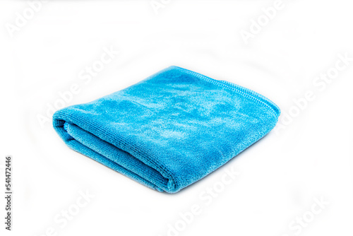 Fotografie A blue microfiber cloth in two folded on white background
