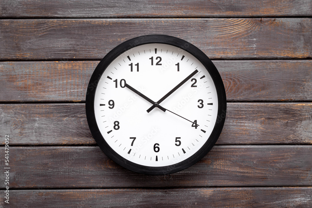 Office wall clock. Black and white clock - time to work concept Office wall clock. Black and white clock - time to work concept