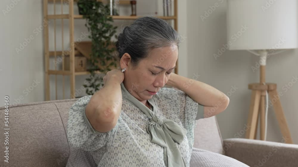 Mature asian elderly woman having migraine and headache pain,Senior healthy concept Mature asian elderly woman having migraine and headache pain,Senior healthy concept