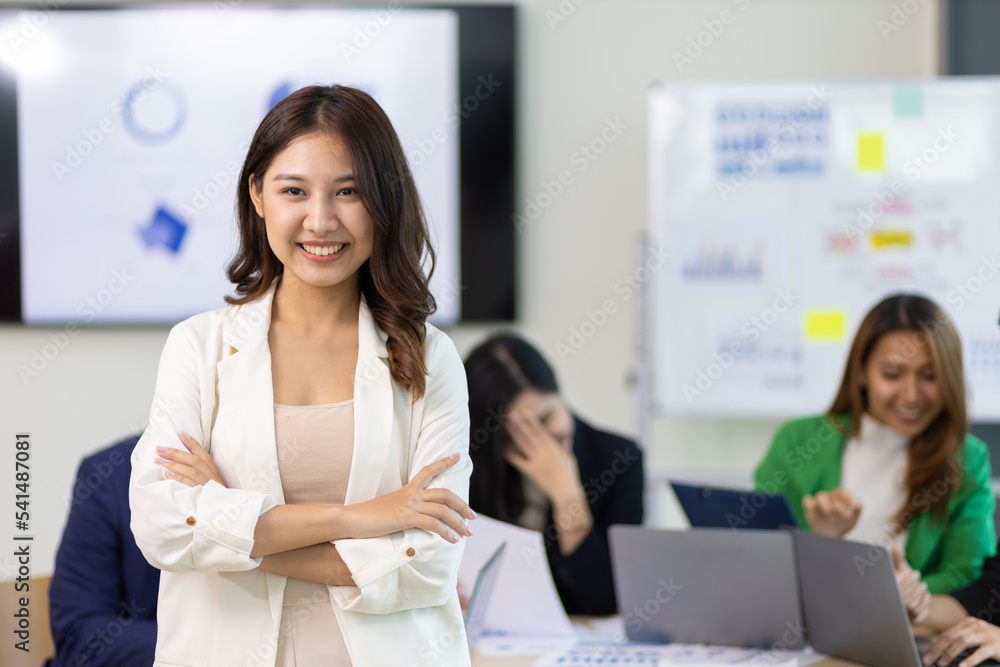 Fototapeta premium Portrait of a attractive business woman in a business office meeting room.