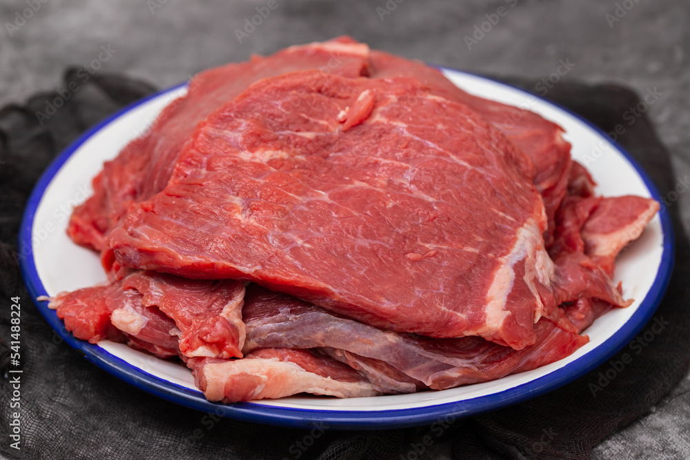 Fresh raw beef steak on white dish