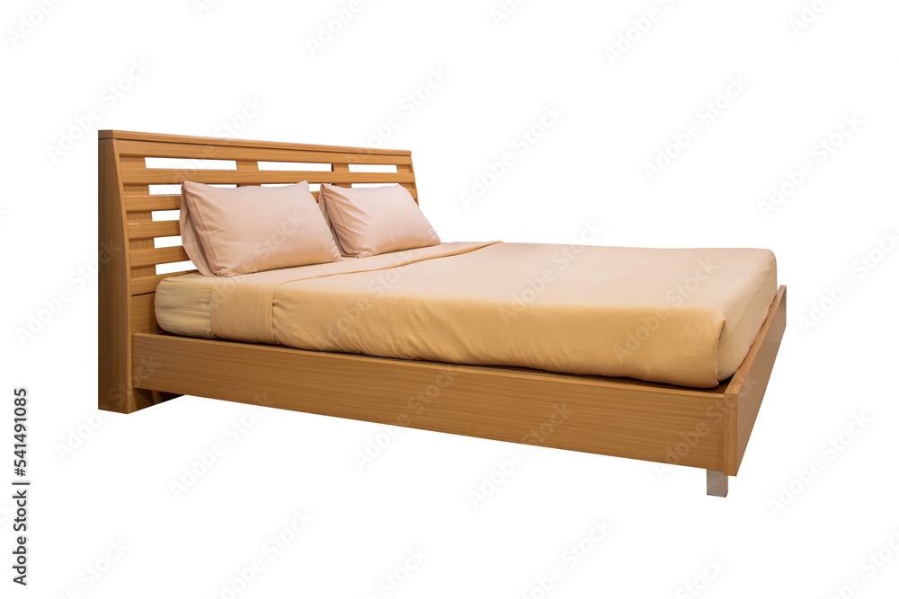 Wooden bed with light brown bedding. Wooden bed with light brown bedding.