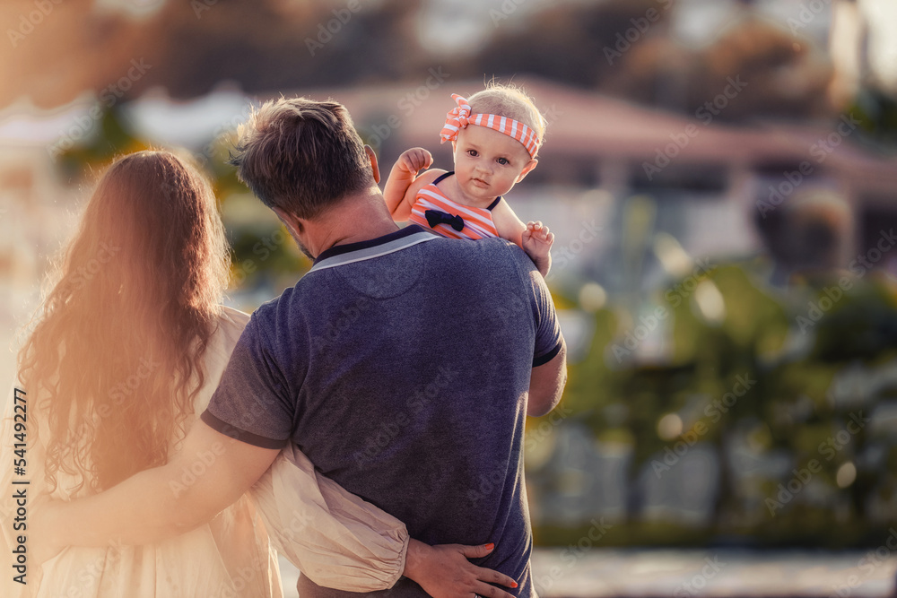 Fototapeta premium couple with baby on the beach