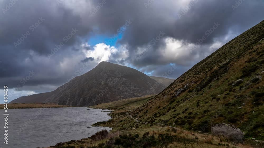 Pen yr Ole Wen mountain and Llyn Idwal lake in Snowdonia National Park Wales. the seventh highest mountain in Snowdonia and in Wales. It is the most southerly of the Carneddau range. Timelapse video Pen yr Ole Wen mountain and Llyn Idwal lake in Snowdonia National Park Wales. the seventh highest mountain in Snowdonia and in Wales. It is the most southerly of the Carneddau range. Timelapse video
