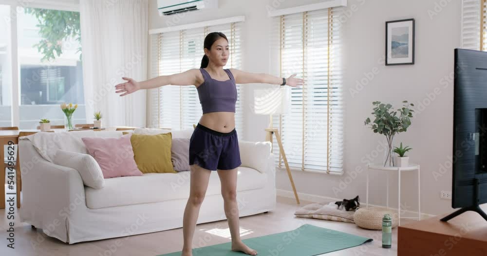 Young adult asia people girl fun squat weight loss on TV online gym class at home. Active self love good shape woman enjoy diet course wear smart watch health IOT fitness tracker internet of things. Young adult asia people girl fun squat weight loss on TV online gym class at home. Active self love good shape woman enjoy diet course wear smart watch health IOT fitness tracker internet of things.
