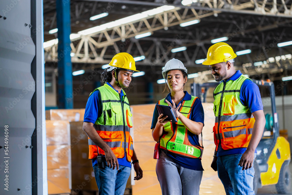 Warehouse worker team checking containers box with goods, Workers team taking inventory in factory warehouse, Foreman workers working in warehouse talking about job Warehouse worker team checking containers box with goods, Workers team taking inventory in factory warehouse, Foreman workers working in warehouse talking about job