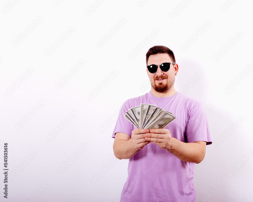 Handsome young man with sunglasses and a lot of money Handsome young man with sunglasses and a lot of money