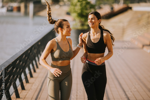 Young woman taking running ...