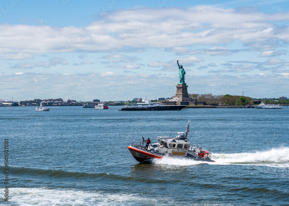 Fototapeta premium U.S. Coast Guard Response Boat - Medium and Statue of Liberty