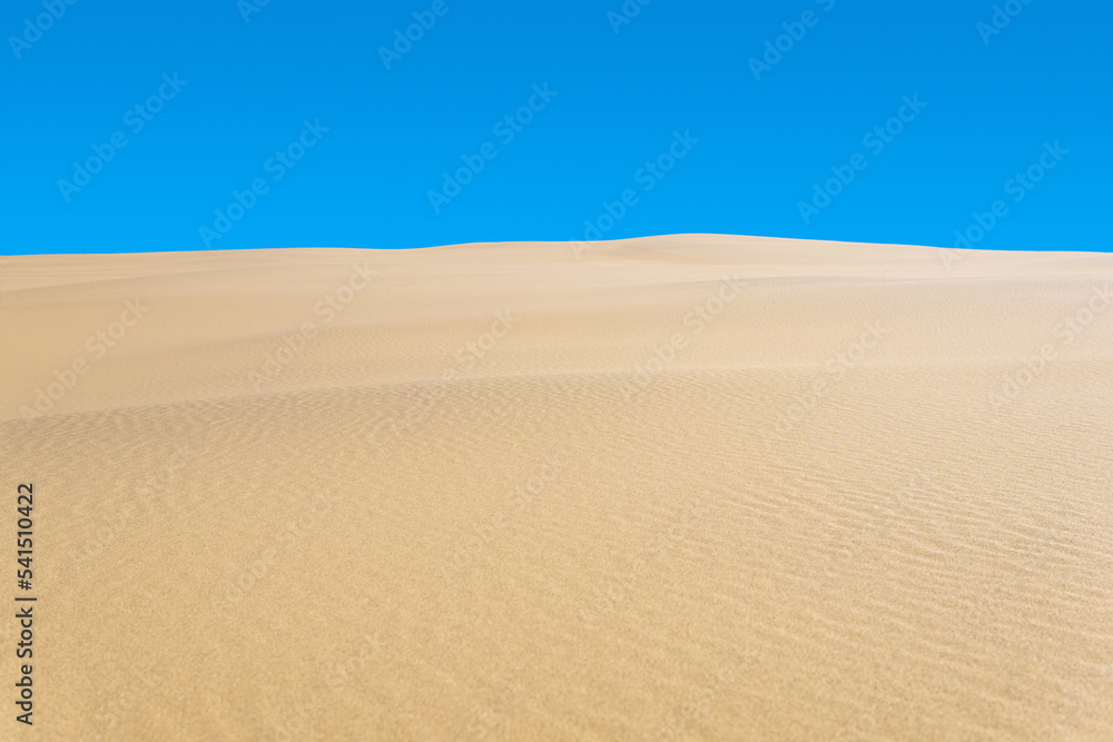 desert landscape, sand dunes under blue sky desert landscape, sand dunes under blue sky