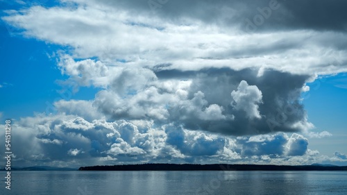 Dark storm clouds over James Island near Sidney, Vancouver Island, BC Canada © David Hutchison/Wirestock Creators