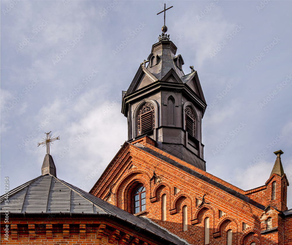 General view and architectural details of the brick belfry built in 1875 and the Catholic Church of the Immaculate Conception of the Blessed Virgin Mary in Ceranów in Mazovia, Poland.