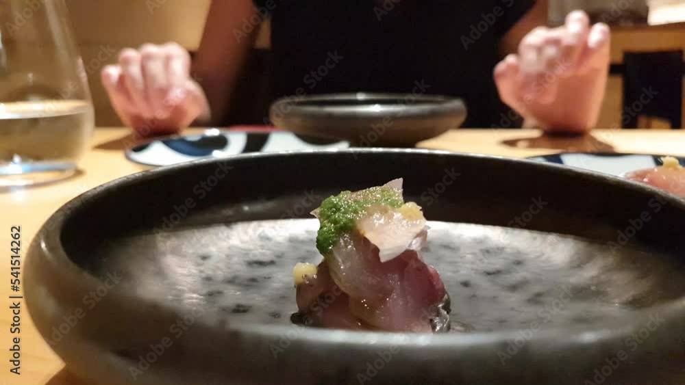 woman eats japanese food delicacies sushi nigiri haute cuisine select food healthy asian hands detail chopsticks woman eats japanese food delicacies sushi nigiri haute cuisine select food healthy asian hands detail chopsticks