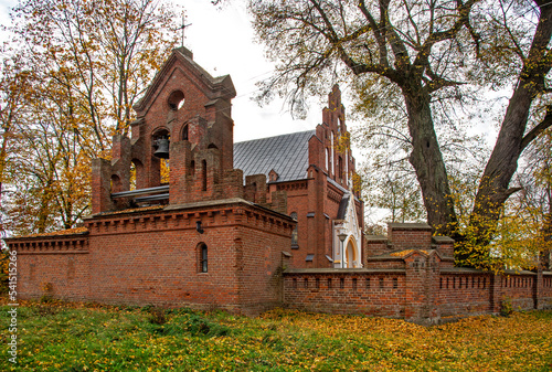 General view and architectural details of the brick belfry built in 1875 and the Catholic Church of the Immaculate Conception of the Blessed Virgin Mary in Ceranów in Mazovia, Poland.