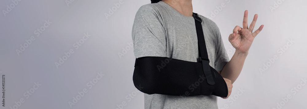 Broken arm. Arm Sling therapy support and covered around elbow first ...
