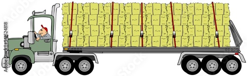 Semi truck pulling a load of hay bales