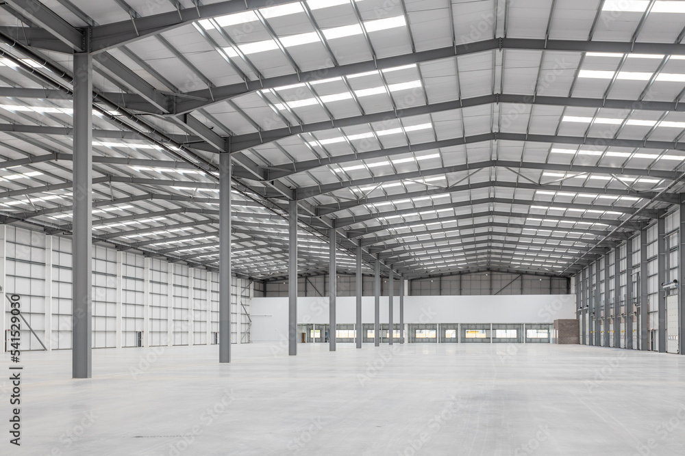 An interior of a large warehouse An interior of a large warehouse