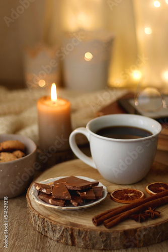 Wallpaper Mural Plate of chocolate chip cookies, stack of vintage books, reading glasses, cup of tea or coffee, lit candle and fairy lights. Hygge at home. Selective focus. Torontodigital.ca