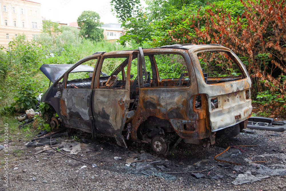 Car after a fire. Burnt rusty car after fire or accident. Car after the fire, crime of vandalism, riots. Arson car. Accident on the road due to speeding. Explosion. Car after a fire. Burnt rusty car after fire or accident. Car after the fire, crime of vandalism, riots. Arson car. Accident on the road due to speeding. Explosion.