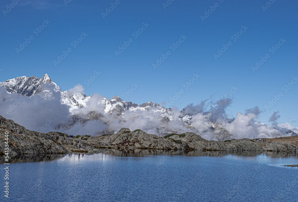 Obraz premium View of the bigger Lac Besson and the smaller Lac Rond , located near the ski resort of Alpe d'Huez, Grand Rousses, Isere, France
