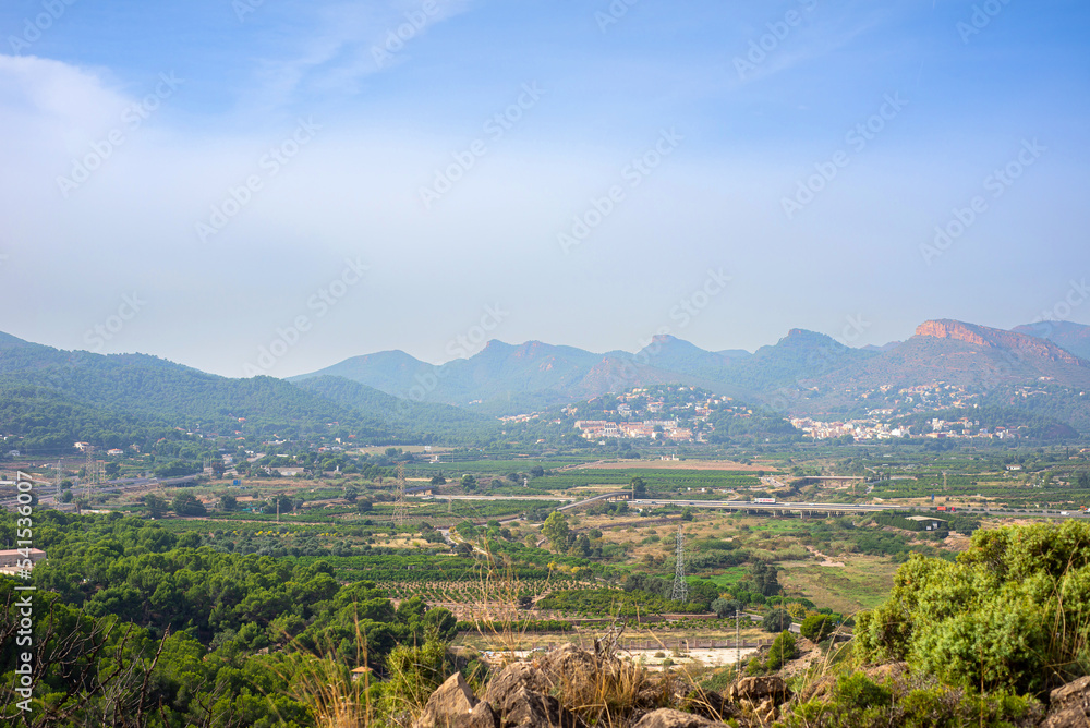 Fototapeta premium landscape view of a nature park with mountains under cloudy blue sky