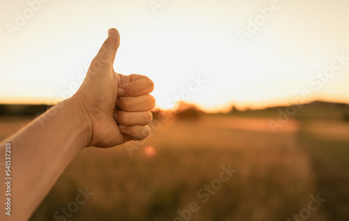 Person with thumbs up, think positive, feel good symbol.