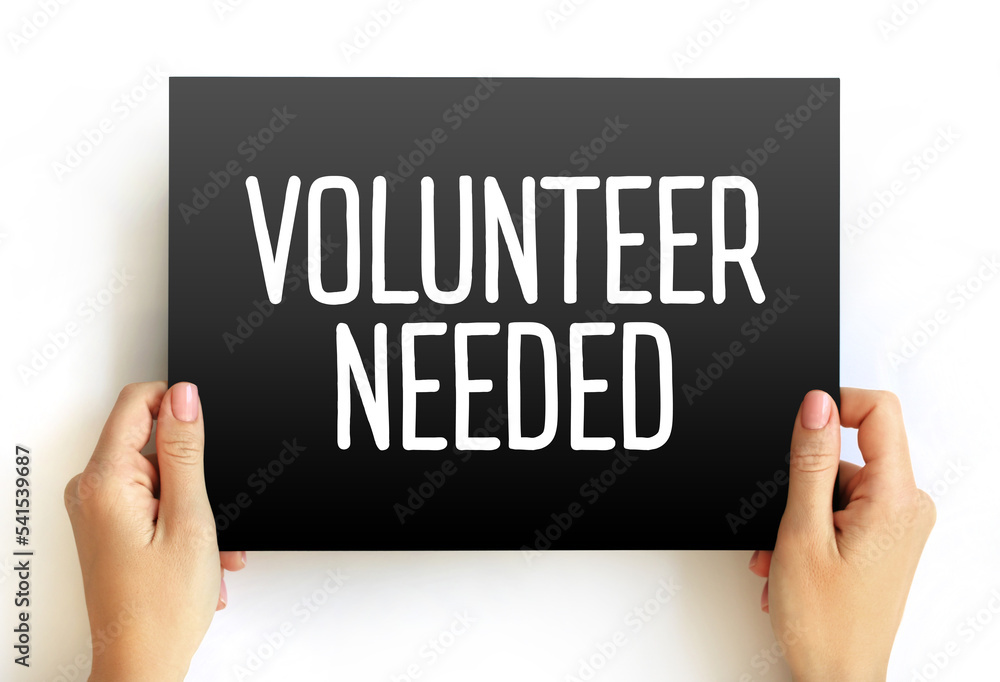 Volunteer Needed text on card, concept background Volunteer Needed text on card, concept background