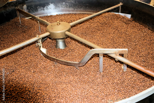 Coffee factory  roasting coffee in a machine in a factory
