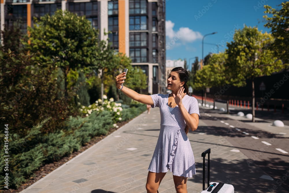 Young woman taking selfies on a phone.