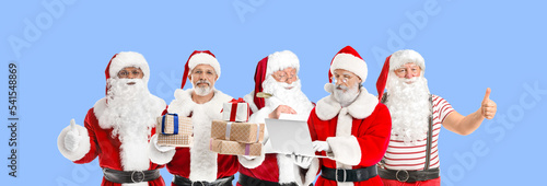 Many Santa Clauses on light...
