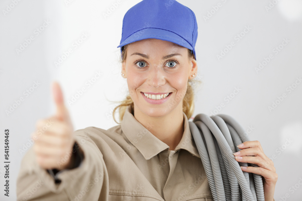 young female builder making thumbs-up gesture young female builder making thumbs-up gesture
