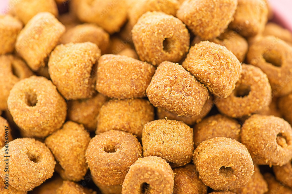 Macro photo of dry food for pets. Balanced nutrition for animals. Macro photo of dry food for pets. Balanced nutrition for animals.