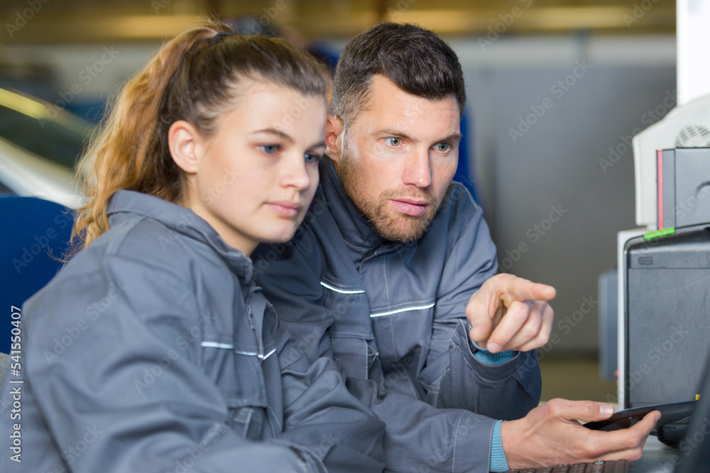 carpenter woman and man in workshop carpenter woman and man in workshop
