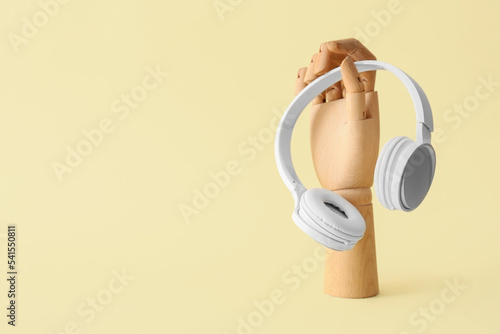 Wooden hand with headphones...
