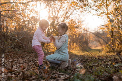 children walk, play, socialize and have fun in the autumn park on a warm sunny day, lifestyle © КРИСТИНА Игумнова