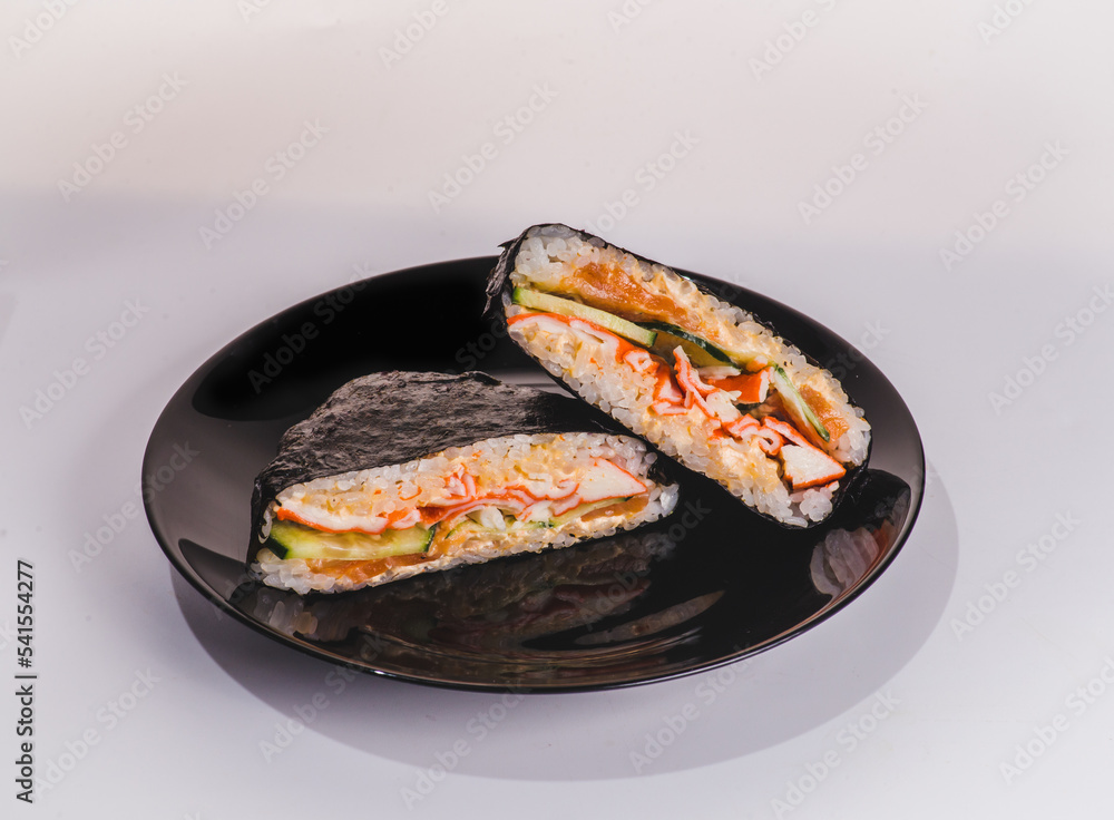 Japanese rice sandwich onigirazu with luncheon meat and vegetables. Healthy dinner recipe and idea. Colorful japan sandwich onigirazu Japanese rice sandwich onigirazu with luncheon meat and vegetables. Healthy dinner recipe and idea. Colorful japan sandwich onigirazu
