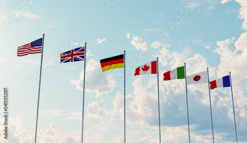 G7 flags of countries of Group of Seven Canada, Germany, Italy, France, Japan, USA states, United Kingdom. Blue sky background. photo